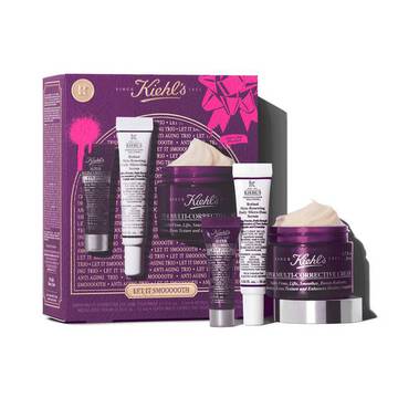 A graphic featuring a purple Kiehl’s gift box with gold accents on the left. The box contains three products. To the right of the box, the same three products are displayed outside of the box: a small purple tube of "Kiehl's Super Multi-Corrective Eye Zone Treatment," a white and purple tube of "Kiehl's Retinol Skin-Renewing Daily Micro-Dose Serum," and a purple jar of "Kiehl's Super Multi-Corrective Cream" with visible cream. The box is decorated with bright pink graphic paint splatters and a bow design, and features the text "LET IT SMOOOOOTH" at the bottom.