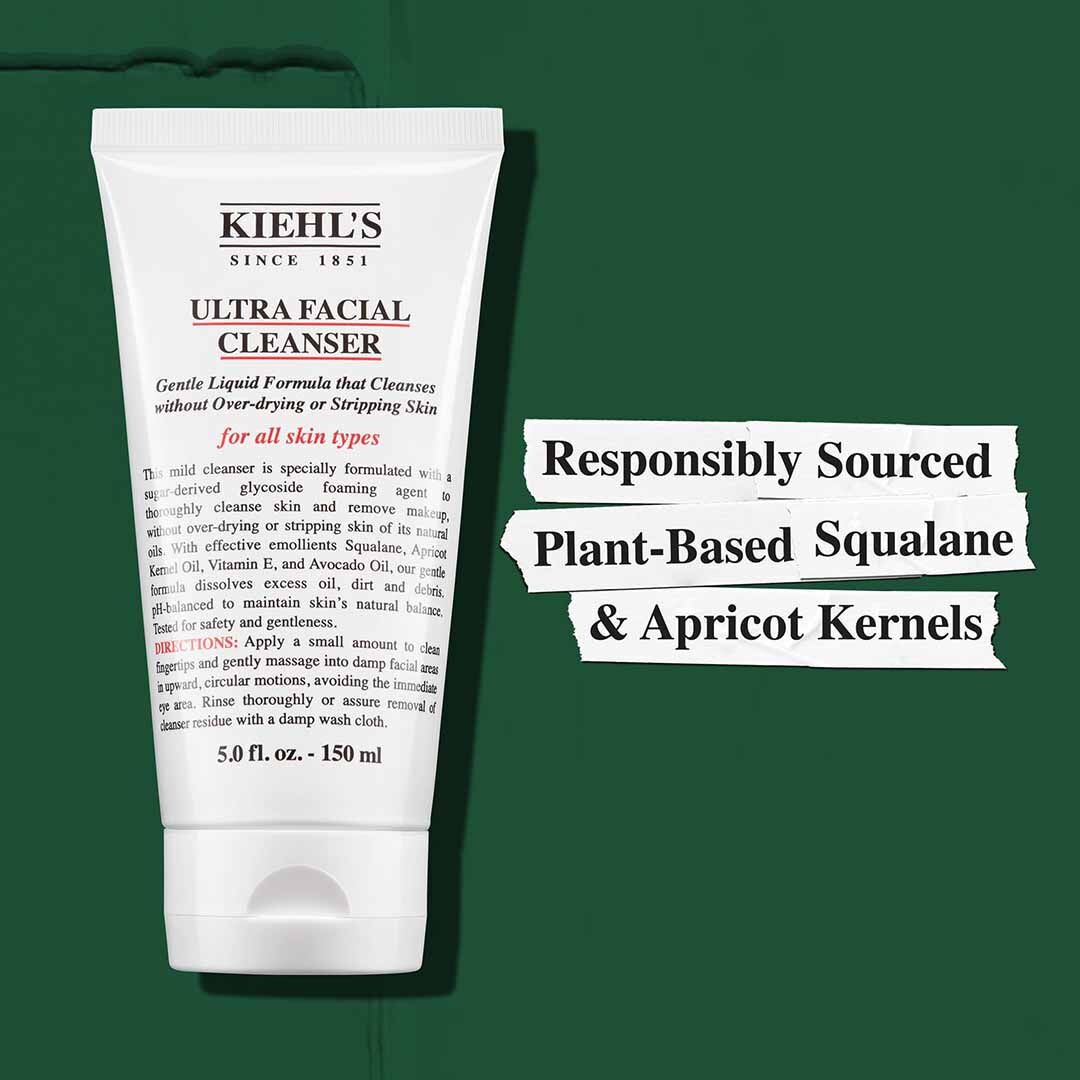 Kiehl’s Ultra Facial Cleanser product shot on a green background with ingredient callouts.